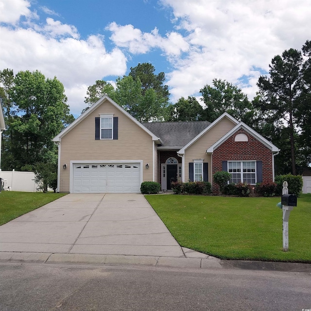 view of front of home featuring a garage and a front yard