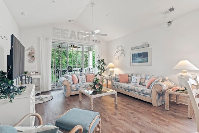 living room with vaulted ceiling, wood-type flooring, and ceiling fan