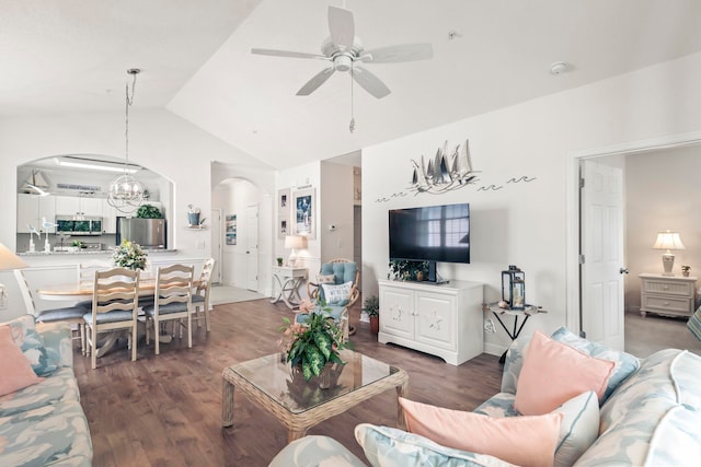 living room with vaulted ceiling, dark hardwood / wood-style floors, and ceiling fan