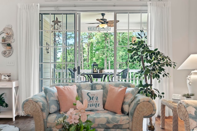 sunroom / solarium featuring ceiling fan