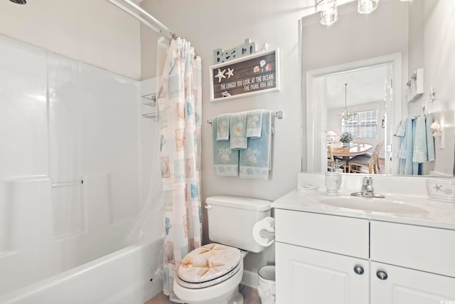 full bathroom with vanity, shower / tub combo, and toilet