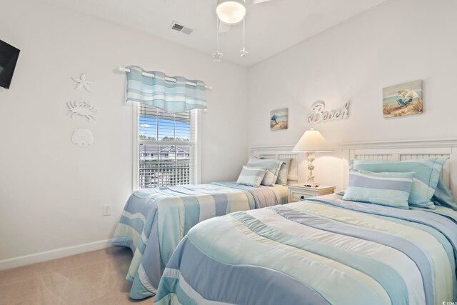 bedroom featuring light carpet and ceiling fan