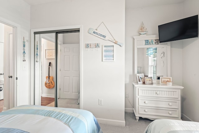 carpeted bedroom with a closet