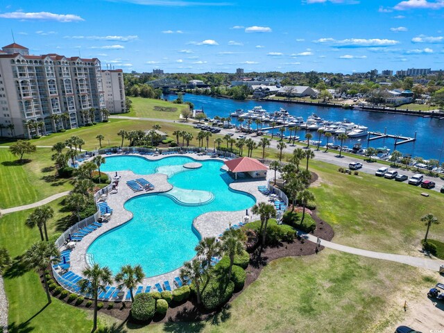 birds eye view of property with a water view