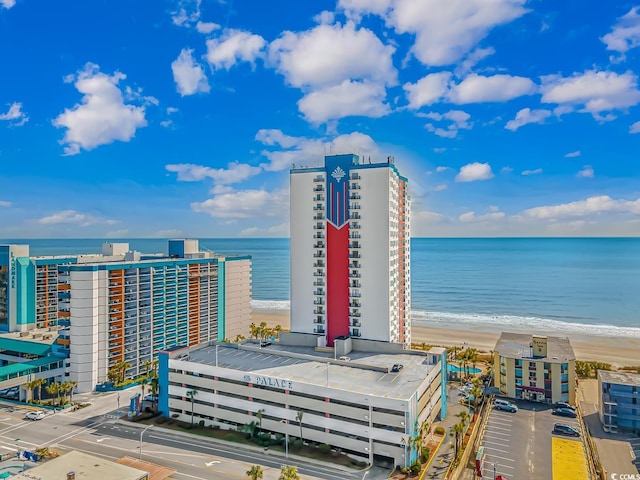 city view featuring a view of the beach and a water view