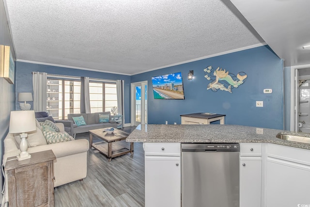 kitchen with white cabinetry, crown molding, light hardwood / wood-style floors, and dishwasher