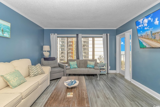 living room with wood-type flooring and a textured ceiling