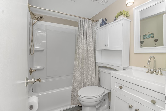 full bathroom featuring shower / bathtub combination with curtain, vanity, and toilet