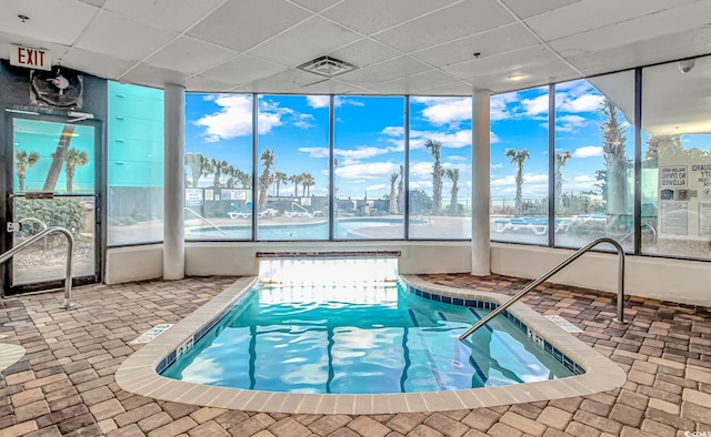 view of pool with a water view