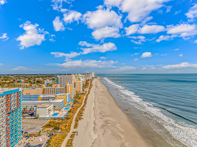 bird's eye view with a water view and a view of the beach