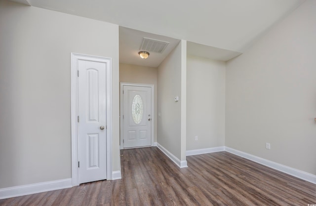 foyer entrance featuring dark hardwood / wood-style floors