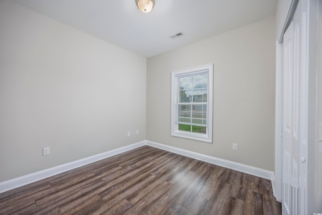 empty room featuring dark hardwood / wood-style floors