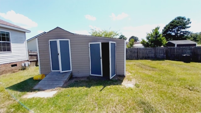 view of outdoor structure with a lawn