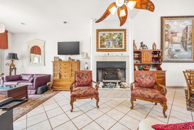 living room featuring ceiling fan and light tile patterned flooring