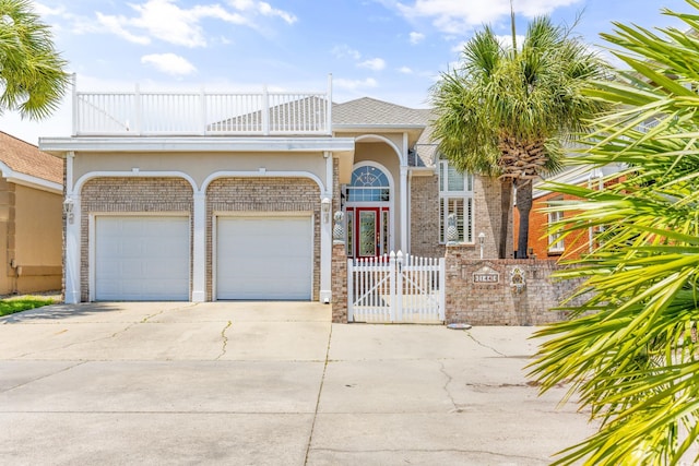 view of front of home featuring a garage and a balcony