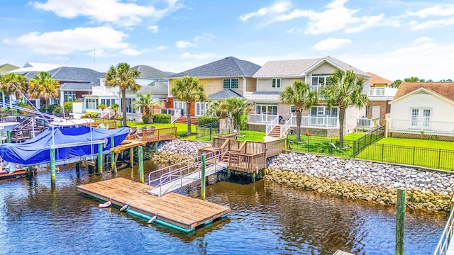 dock area featuring a yard and a water view