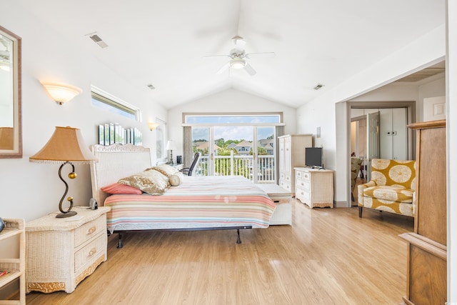 bedroom featuring ceiling fan, vaulted ceiling, light hardwood / wood-style floors, access to outside, and a closet