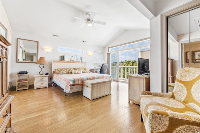 bedroom with ceiling fan, lofted ceiling, light wood-type flooring, and access to outside