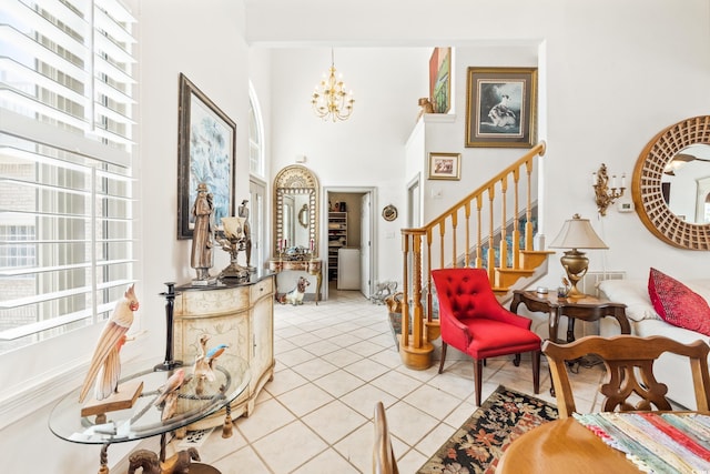 foyer featuring an inviting chandelier, light tile patterned floors, and a wealth of natural light