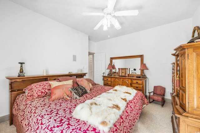 bedroom with light carpet and ceiling fan