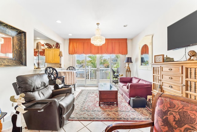 living room with light tile patterned floors and a chandelier