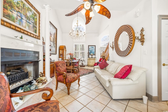 interior space with lofted ceiling and ceiling fan with notable chandelier