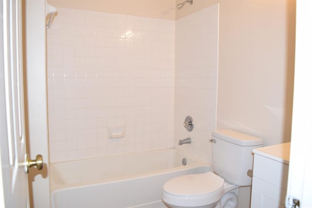 full bathroom featuring vanity, toilet, and tiled shower / bath combo