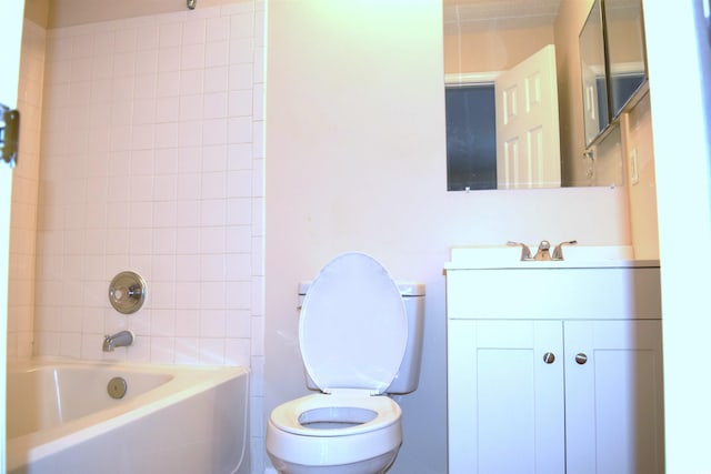 full bathroom with vanity, toilet, and tiled shower / bath combo