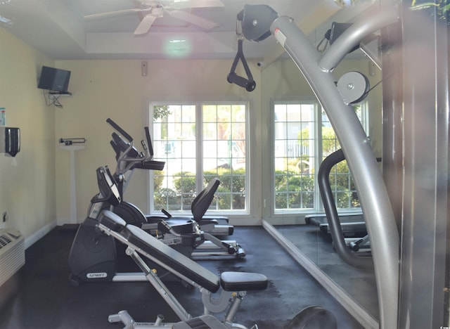 gym featuring a wealth of natural light and ceiling fan