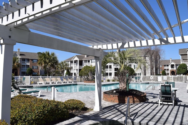 view of pool with a pergola and a patio