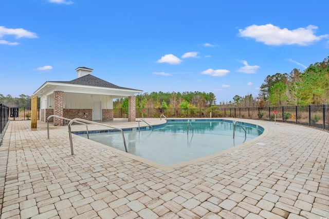 view of swimming pool featuring a gazebo and a patio