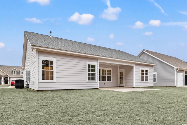 rear view of house featuring a patio area, central AC unit, and a lawn