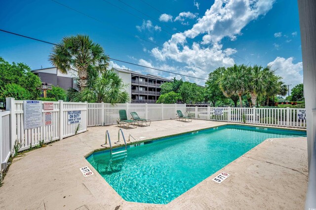 view of pool featuring a patio area