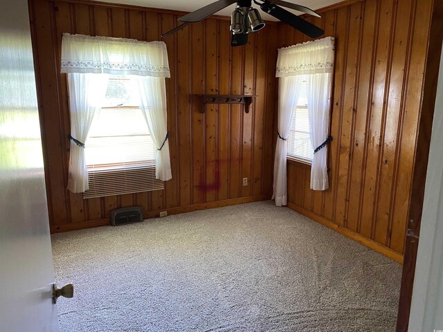 4155 Pinewood Dr, Mullins, SC 29574 - carpeted spare room with ceiling fan and wood walls