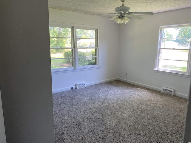 4155 Pinewood Dr, Mullins, SC 29574 - empty room featuring a textured ceiling, carpet floors, and ceiling fan