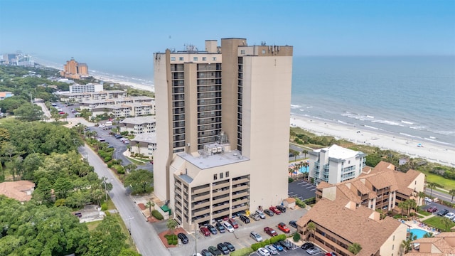 bird's eye view featuring a beach view and a water view