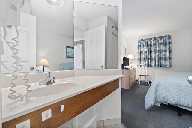 bathroom with vanity and a textured ceiling