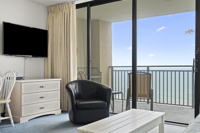 interior space with a water view and light carpet