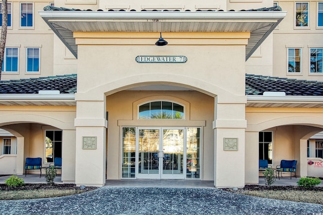 property entrance featuring french doors