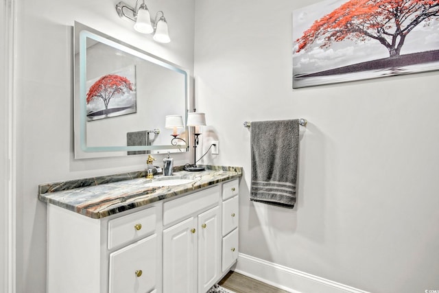 bathroom with vanity and hardwood / wood-style floors