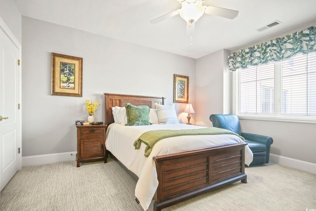 bedroom featuring ceiling fan and light carpet