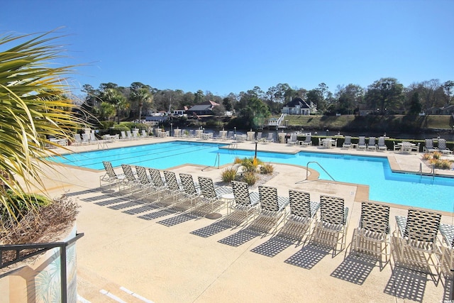 view of swimming pool with a patio area