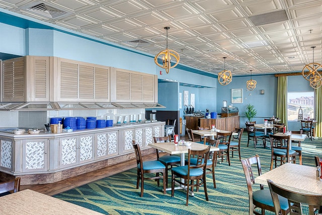 dining space with an ornate ceiling and wood finished floors