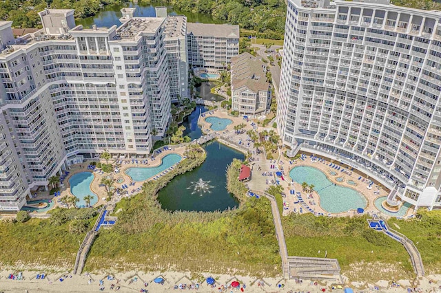 drone / aerial view featuring a water view and a city view