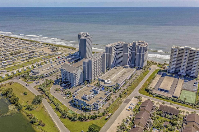 drone / aerial view featuring a view of city and a water view