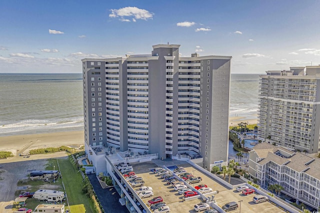 aerial view featuring a water view and a beach view