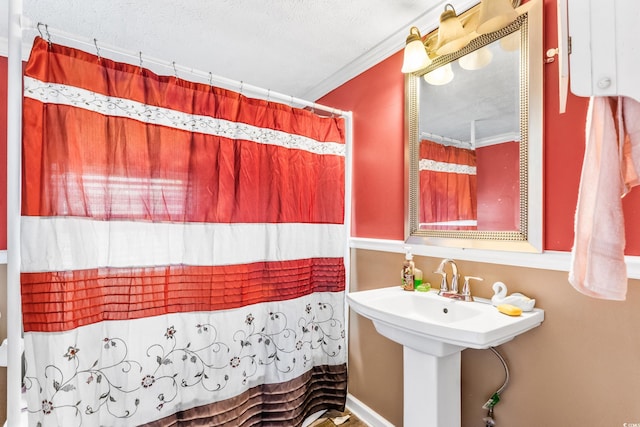 bathroom with crown molding, a textured ceiling, and walk in shower