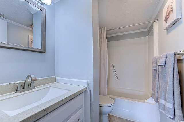 bathroom with a textured ceiling, shower / bath combo, vanity, and toilet