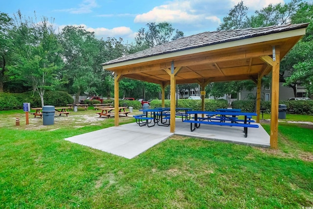 view of property's community with a yard and a gazebo