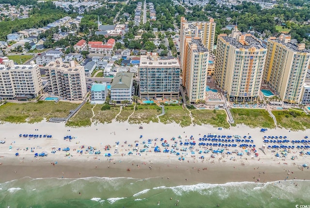 bird's eye view featuring a beach view and a water view